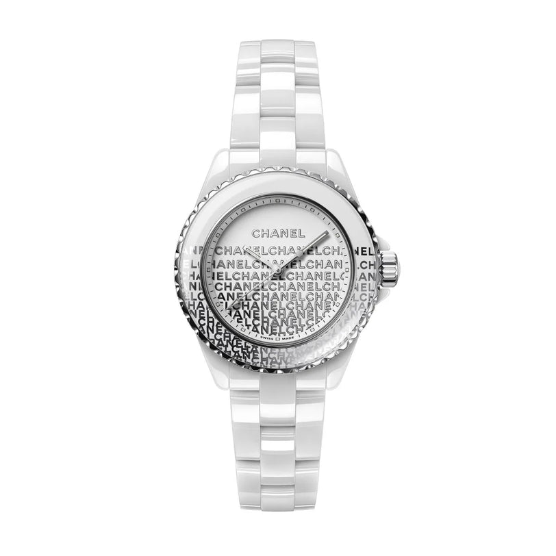 The J12 Wanted de Chanel is a white ceramic wristwatch by Chanel, featuring a steel bezel, a patterned dial with repeated black "CHANEL" text, and a sleek metal-accented bracelet for a modern, highly resistant design.