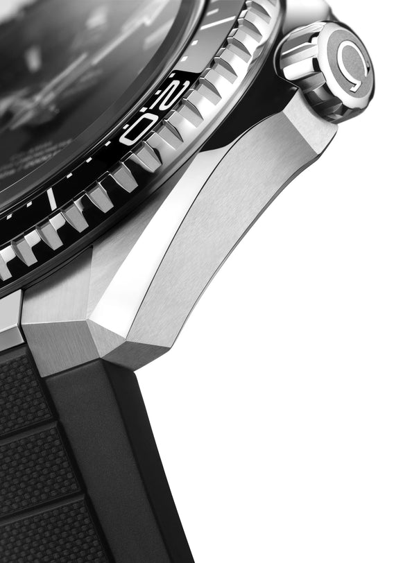 Close-up of the OMEGA Seamaster Planet Ocean 42mm wristwatch featuring its stainless steel bezel, crown with OMEGA logo, brushed metal case, and textured black strap against a white background.