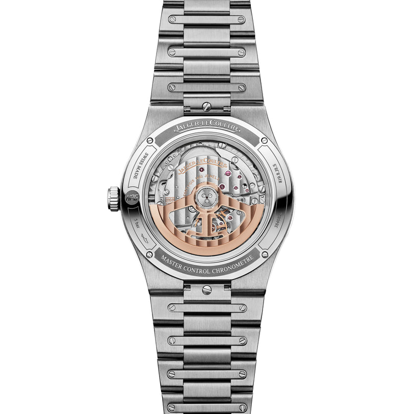 Stainless steel watch with two-tone dial displaying exposed movement, date window, and linked bracelet with brushed finish.
