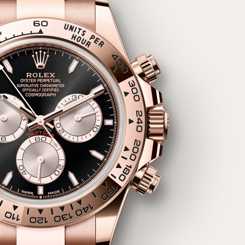 Close-up of a Rolex Oyster Perpetual Cosmograph Daytona watch with a black dial and rose gold case.