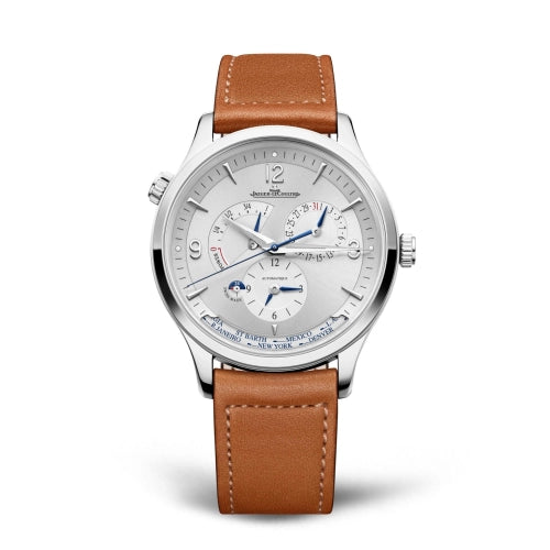 The Jaeger-LeCoultre Master Control Geographic travel watch features a silver case, white dial with multiple subdials, blue hands, and a brown leather strap, shown against a white background.