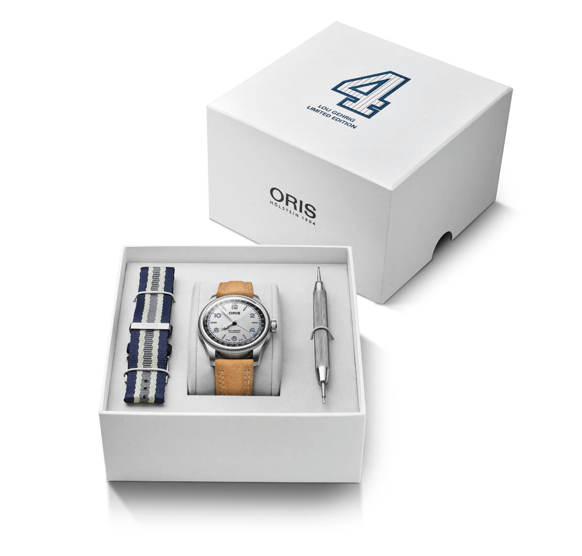 Oris watch set with silver dial and tan leather strap, navy striped fabric strap, and pen in white presentation box.