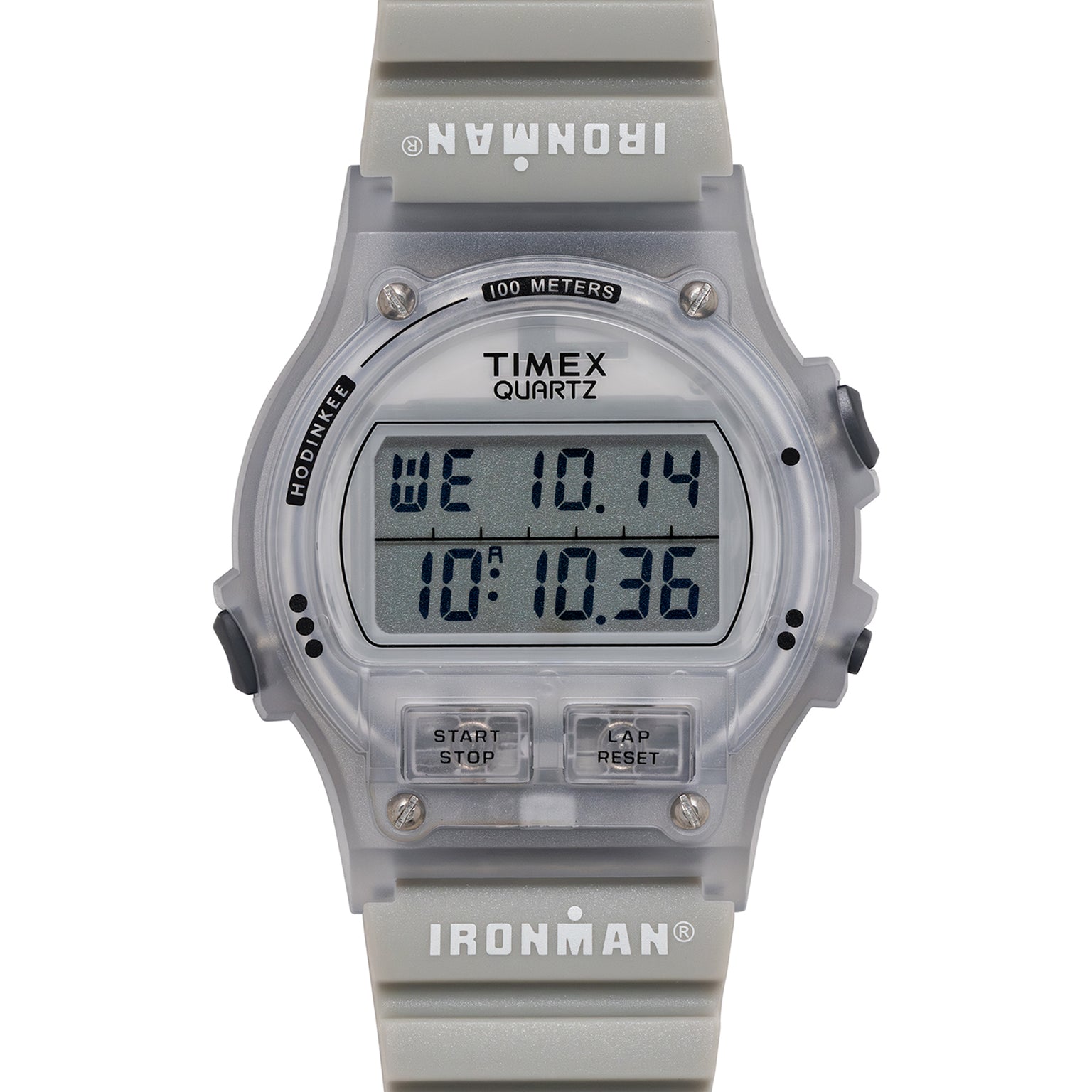 Timex Ironman digital watch with clear case and gray band on a white background