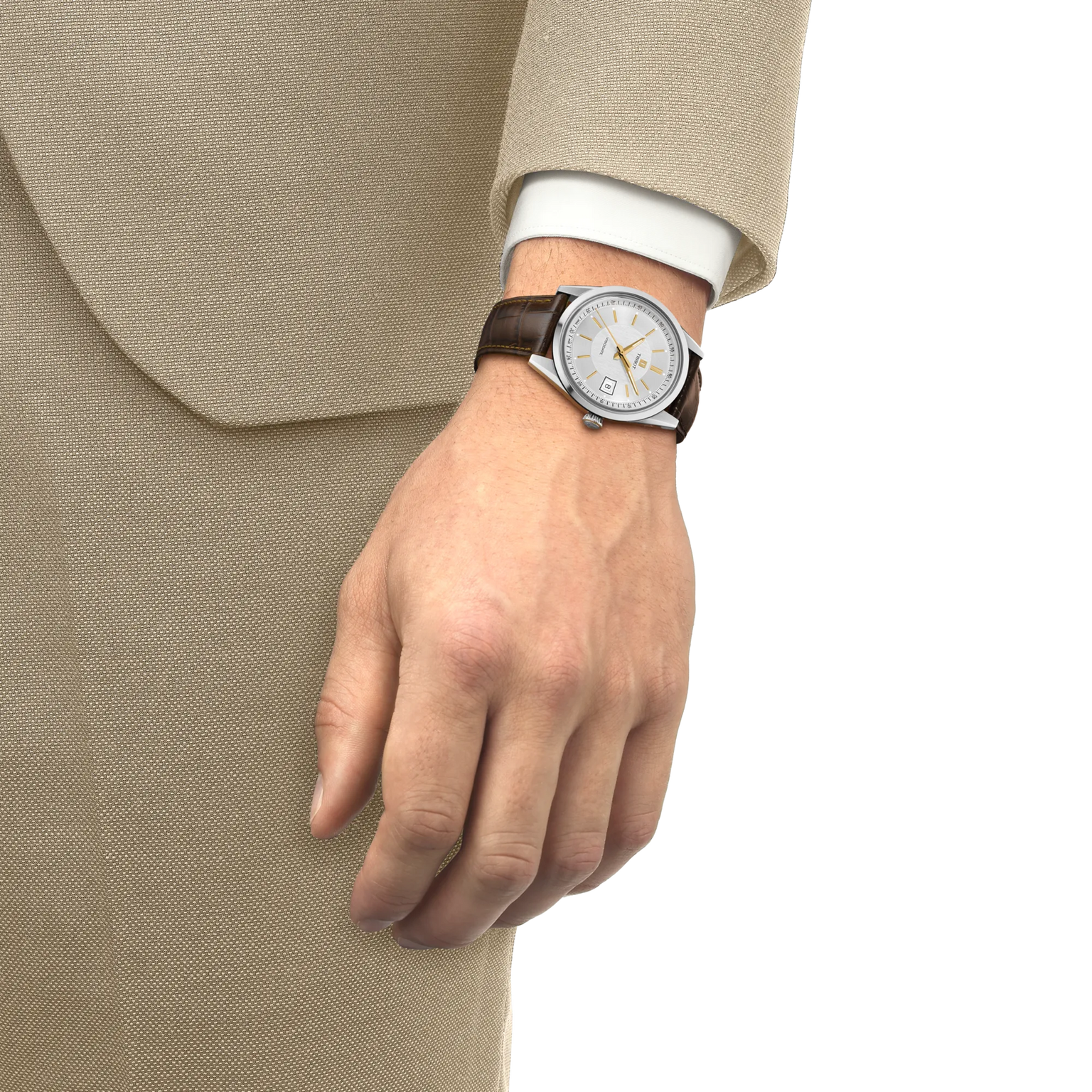 Round watch with white dial, gold accents, and dark leather strap worn on wrist with beige suit jacket.