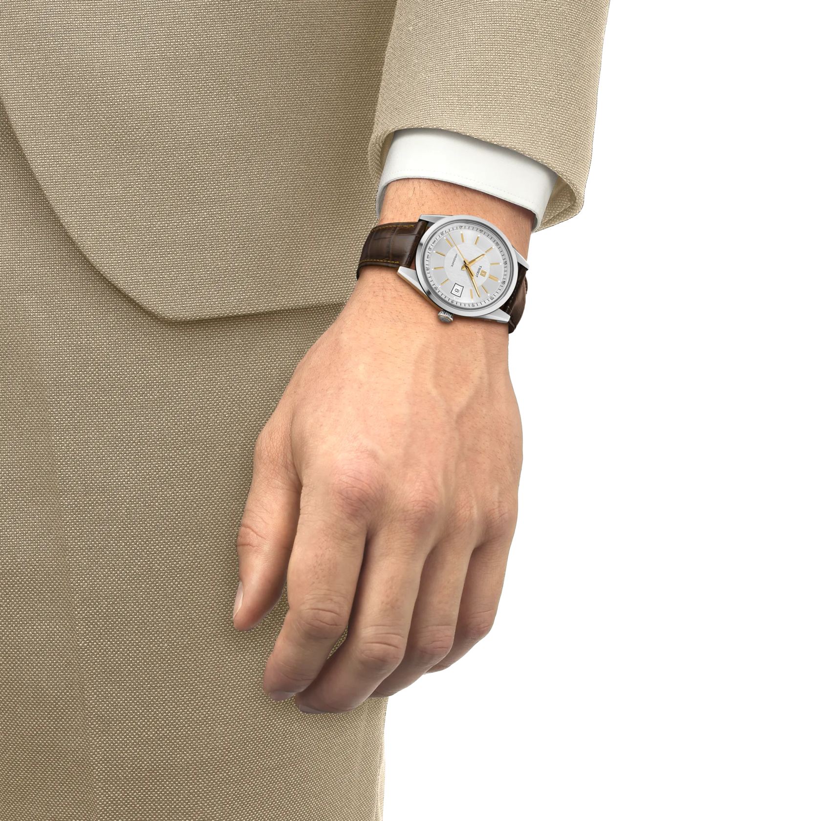 Round watch with white dial, gold accents, and dark leather strap worn on wrist with beige suit jacket.