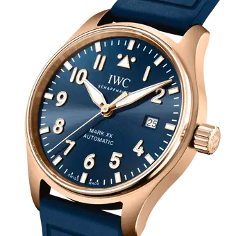 Rose gold watch with blue dial, white numerals and hands, date window, and blue rubber strap.