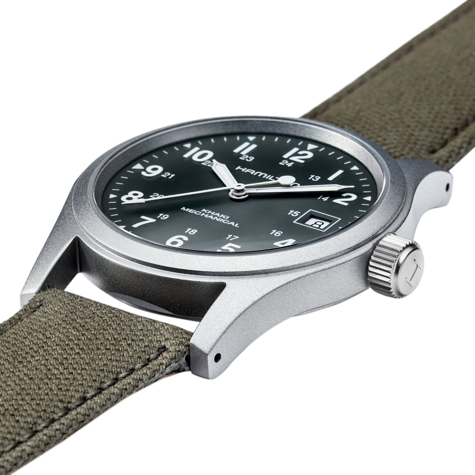 A close-up of the Hamilton Khaki Field Mechanical watch featuring a green fabric strap and black dial with date display.