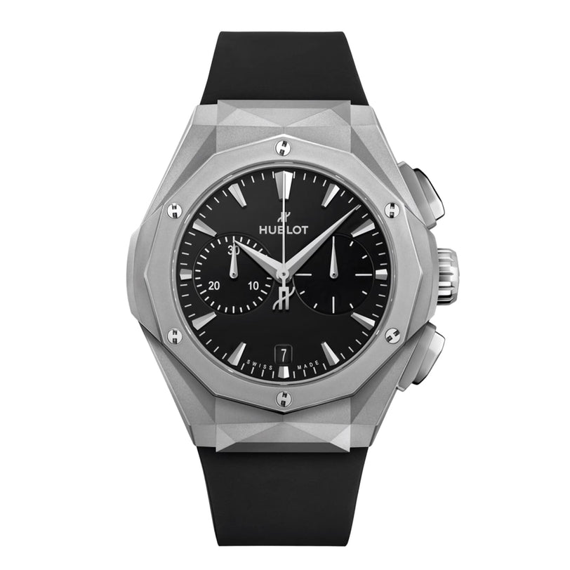 The Hublot Classic Fusion Chronograph Orlinski Titanium features a geometric silver case, black dial with chronograph subdials, date at 6 o’clock, and a sleek black rubber strap.