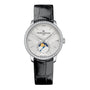 The Girard-Perregaux 1966 Moon Phases is a silver wristwatch with a diamond bezel, black leather strap, and moon phase indicator on the dial.