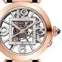 A close-up of the Pasha de Cartier by Cartier, featuring exposed gears, a rose gold case, and a blue cabochon crown.