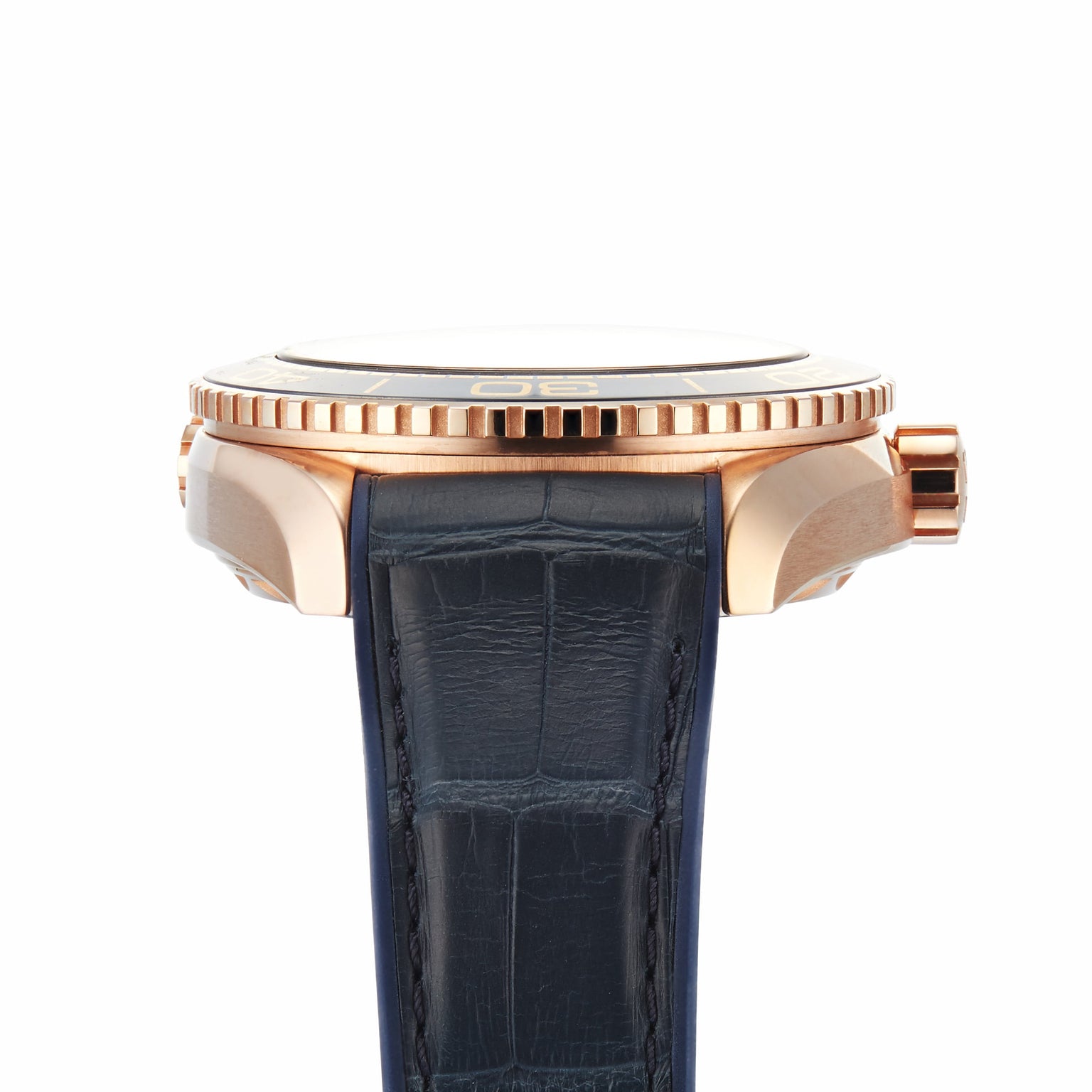 Side view of an OMEGA Seamaster Planet Ocean 600M gold wristwatch with a black leather strap and textured bezel, shown against a white background.