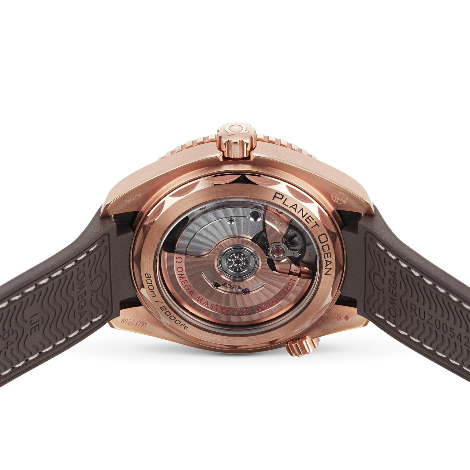 The back view of the OMEGA Seamaster Planet Ocean 600M showcases its exposed mechanical movement, brown rubber strap, and intricate engravings.