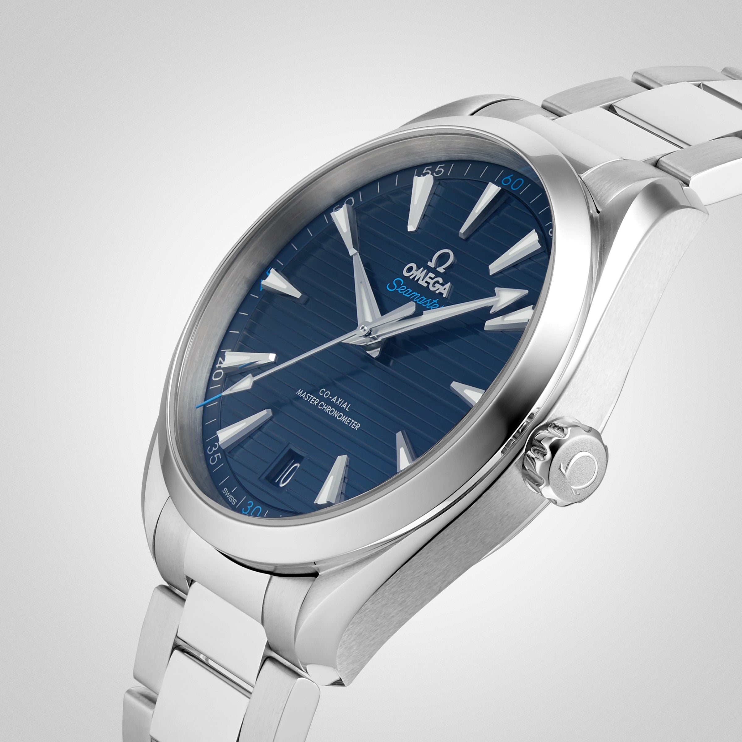 The OMEGA Seamaster Aqua Terra 150M features a blue textured dial, silver hour markers, and a stainless steel bracelet, displayed on a light background.