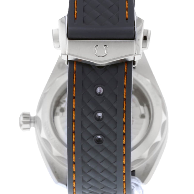 Close-up of the OMEGA Seamaster Aqua Terra 150Ms back, highlighting its black rubber strap with orange stitching, metal clasp with a horseshoe symbol, Master Chronometer certification, and advanced 8900 calibre movement.