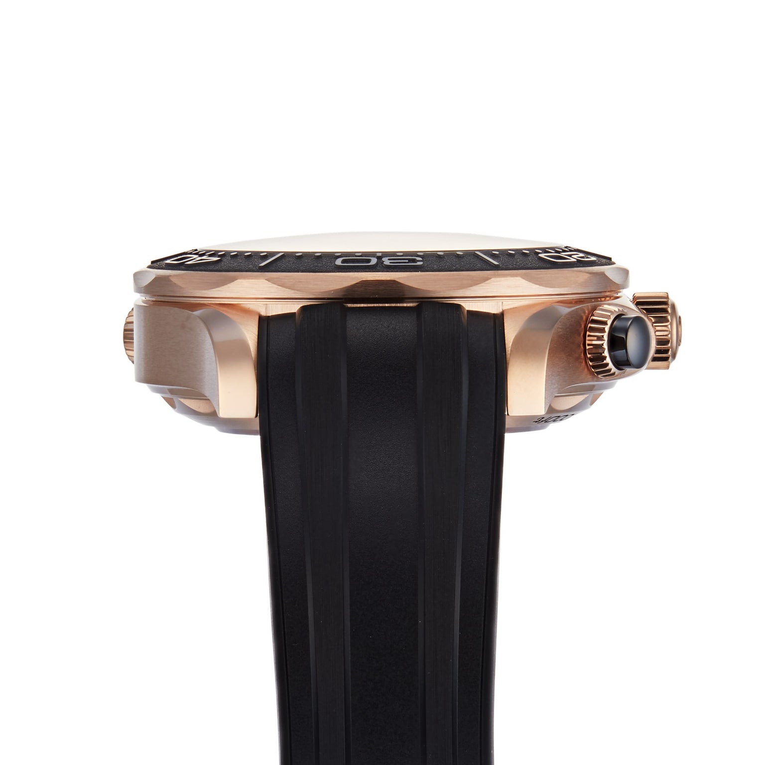 Side view of the OMEGA Seamaster Diver 300M gold watch featuring a black rubber strap, black bezel, and a ridged crown on the right.