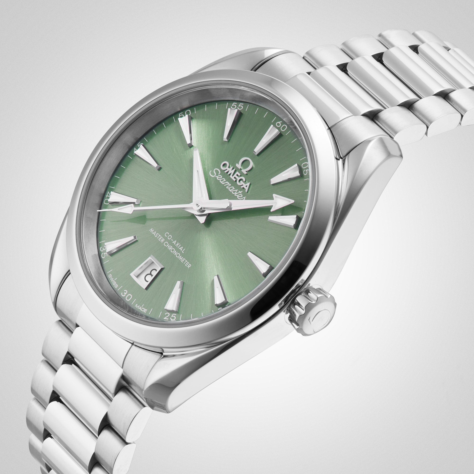 A silver OMEGA Seamaster Aqua Terra 150M wristwatch with a green dial, date at 6 o’clock, metal link bracelet, and the celebrated 8800 calibre movement is displayed against a light background.