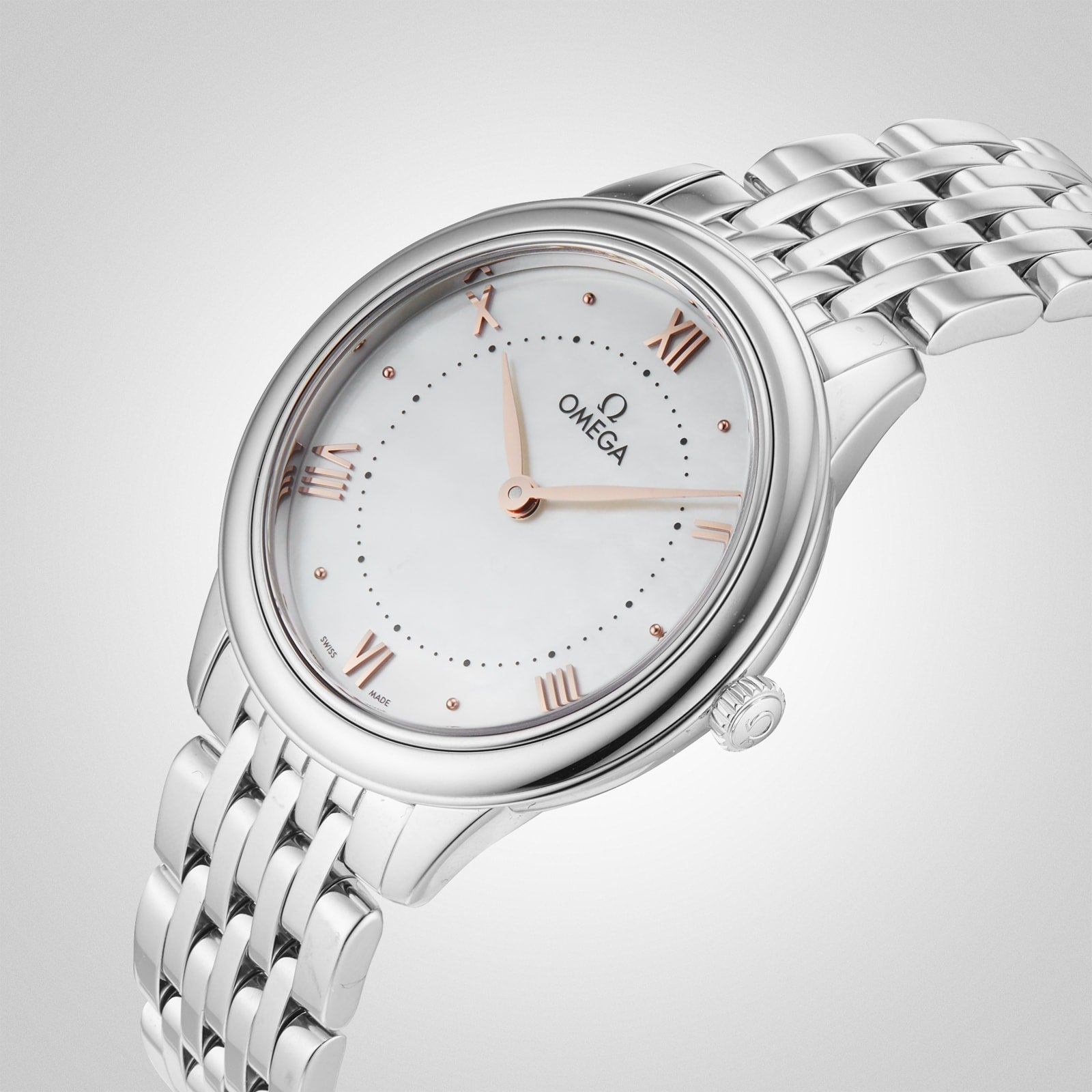 The OMEGA De Ville Prestige wristwatch, featuring a white dial, rose gold Roman numerals, and a silver metal link bracelet, radiates refined elegance against a soft gradient backdrop.