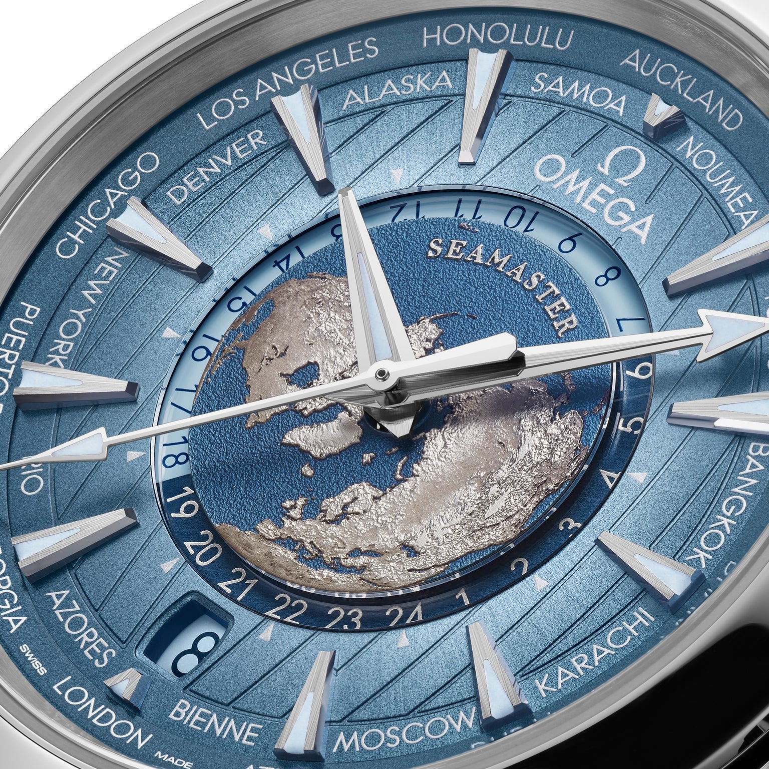 Close-up of the OMEGA Seamaster Aqua Terra 150M watch face, displaying a world map, city names on the bezel, silver hands, and a polished stainless steel case.