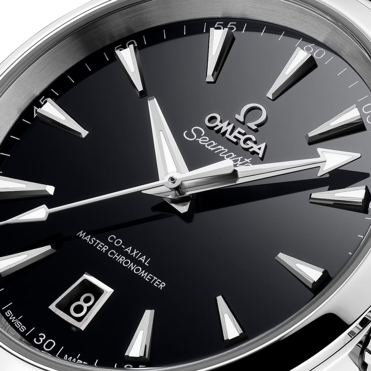 Close-up of an OMEGA Seamaster Aqua Terra 150M watch with silver hour markers, date window at 6 o’clock, and Co-Axial Master Chronometer text on a sleek black dial.