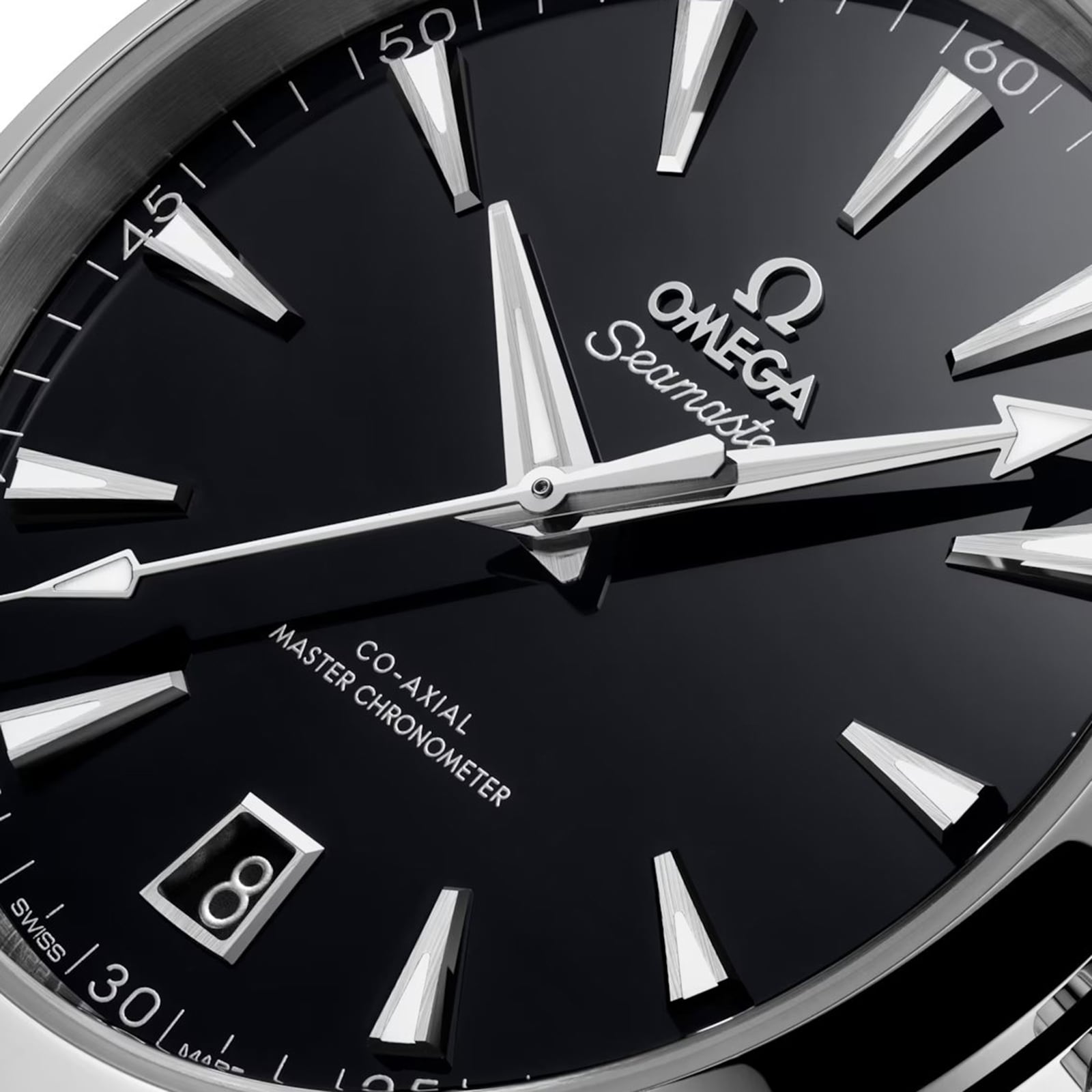 Close-up of an OMEGA Seamaster Aqua Terra 150M watch face, featuring silver hands, hour markers, a date window at 6 o’clock, and Co-Axial Master Chronometer inscriptions.