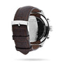Back view of the Tissot Chrono XL Classic featuring a brown leather strap, stainless steel buckle, and engraved silver case back—ideal for luxury watch enthusiasts.