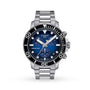 The Tissot Seastar 1000 Chronograph features a 45.5mm stainless steel case, blue dial, black bezel, three subdials, date window, and silver bracelet—designed for style and deep-sea exploration.