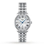 The Tissot Carson Premium features a silver metal link band, white dial, blue hands, black Roman numerals, and a date display at 6 o’clock—a refined wristwatch that exemplifies precision craftsmanship.