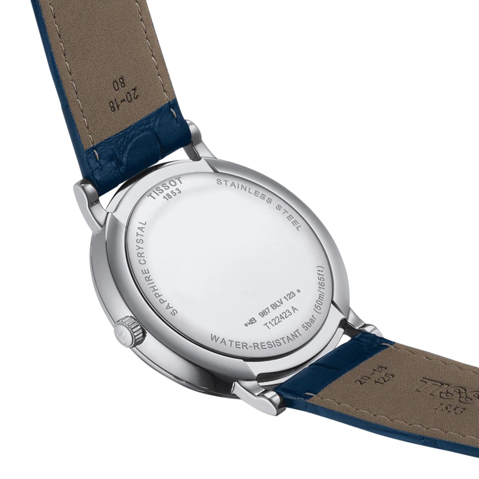 The back of the Tissot Carson Premium Moonphase wristwatch with a blue leather strap displays engravings about the model, water resistance, materials, and its Swiss-made quartz EOL movement.