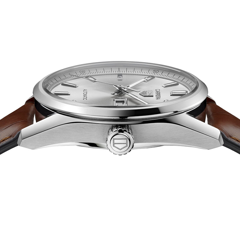 A close-up side view of the TAG Heuer Carrera Day-Date, showing its silver case, crown, brown alligator leather strap, and part of the silver dial with a date window.