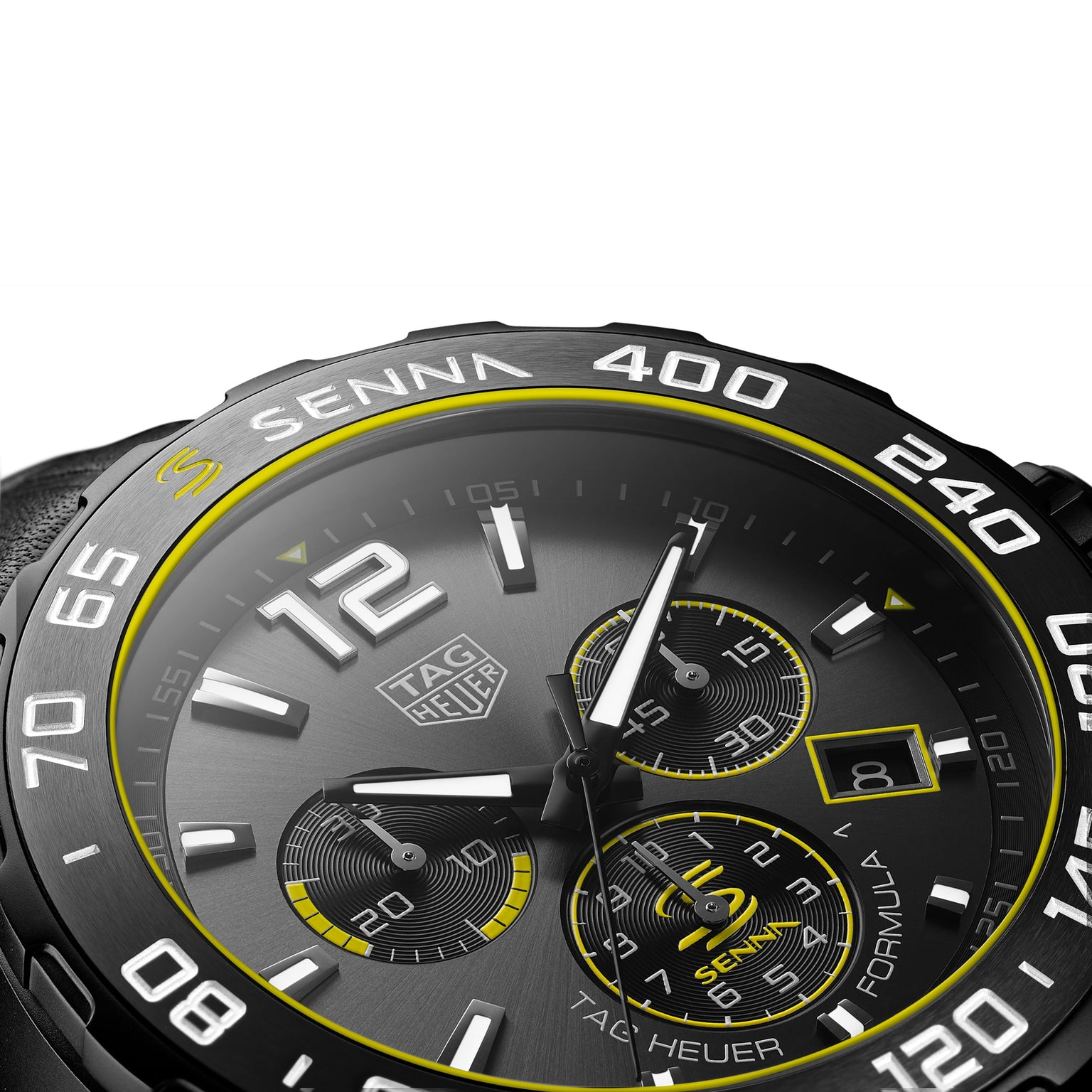 Close-up of the TAG Heuer Special Edition Formula 1 Senna watch, featuring yellow accents, three subdials, and a date display at 4 oclock.