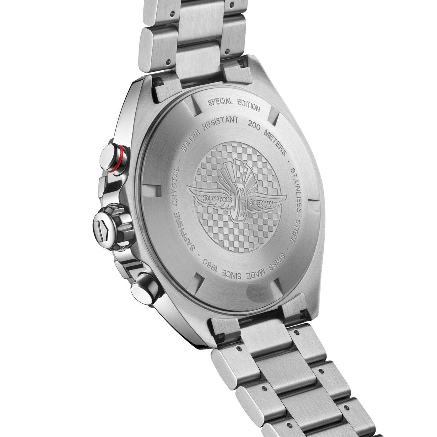 The image shows the back of a TAG Heuer Special Edition Formula 1 X Indy 500 stainless steel watch, featuring engraved branding, specifications like Special Edition and Indy 500, metal bracelet, buttons, and 200 meters water resistance.