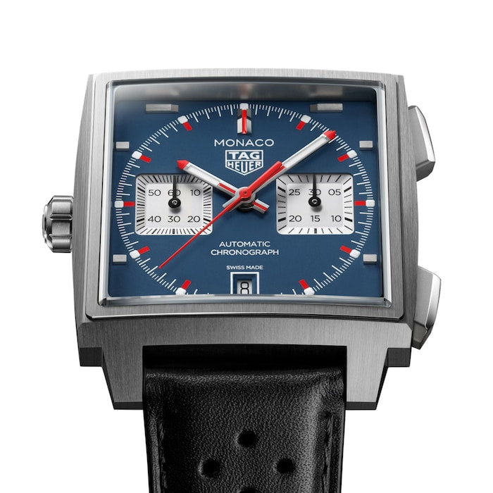 Square stainless steel chronograph watch with blue dial, red hands, two subdials, and black leather strap.