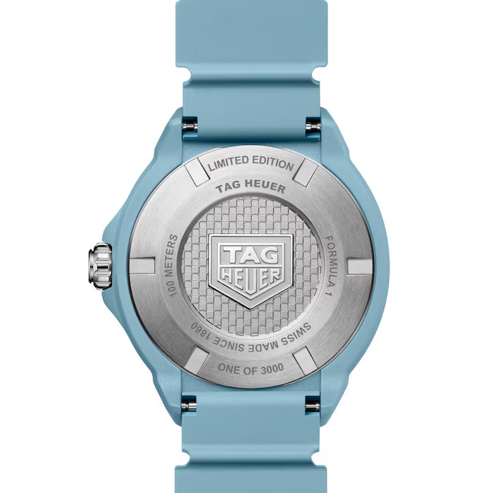 Tag Heuer watch with blue strap and silver case on a white background