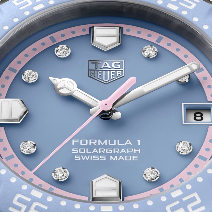 Tag Heuer watch face with blue dial and diamond accents