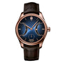 The H. Moser & Cie Endeavour Chinese Calendar is a luxury wristwatch featuring a blue dial, rose gold case, and brown leather strap, complete with multiple displays.