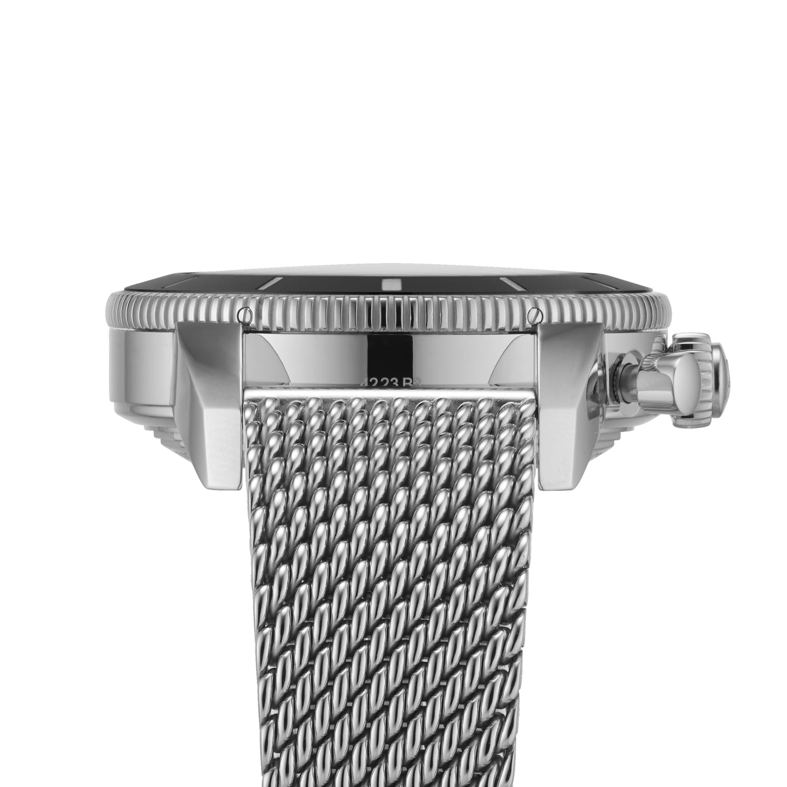 Close-up side view of the Breitling Superocean Heritage B01 Chronograph 44, a silver diver’s watch with a ridged bezel, crown, and woven mesh metal band, powered by the Breitling 01 calibre, shown against a white background.