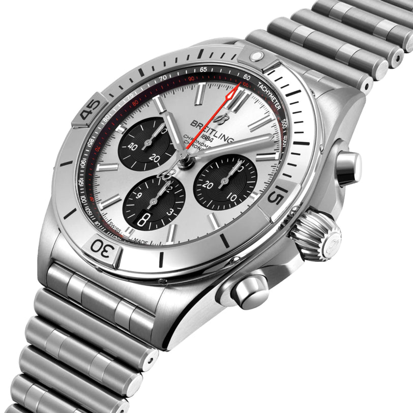 The Breitling Chronomat B01 42 is a stainless steel chronograph wristwatch with a silver dial, three black subdials, signature Rouleaux bracelet, and renowned Breitling 01 mechanical movement.