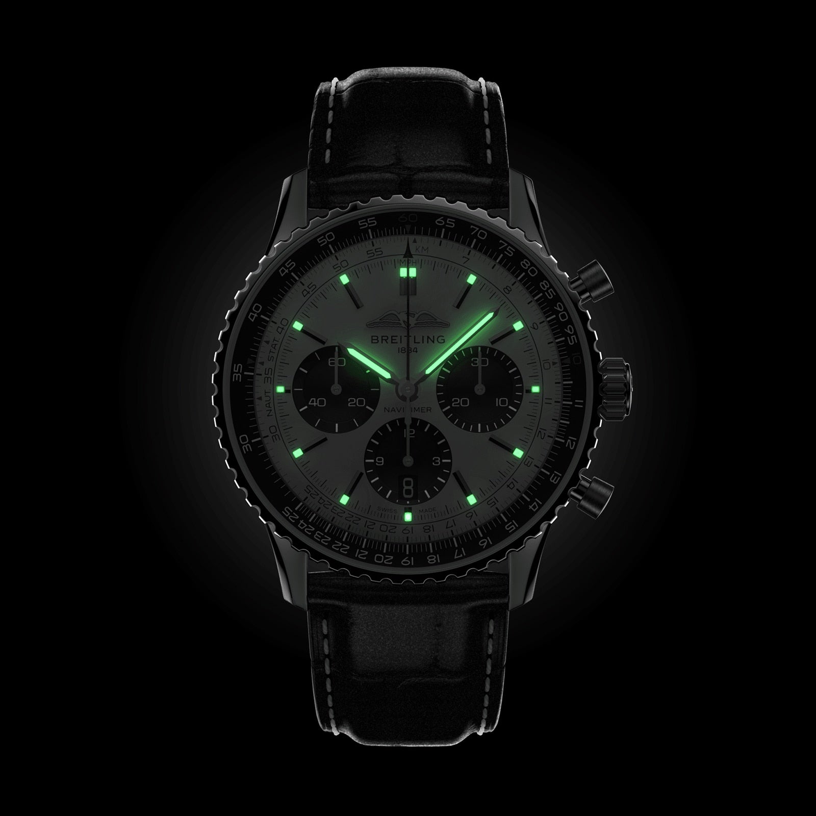 The Breitling Navitimer B01 Chronograph 43 is a black pilots watch featuring a leather strap, luminous green hour markers, and glowing hands that stand out against its black dial.