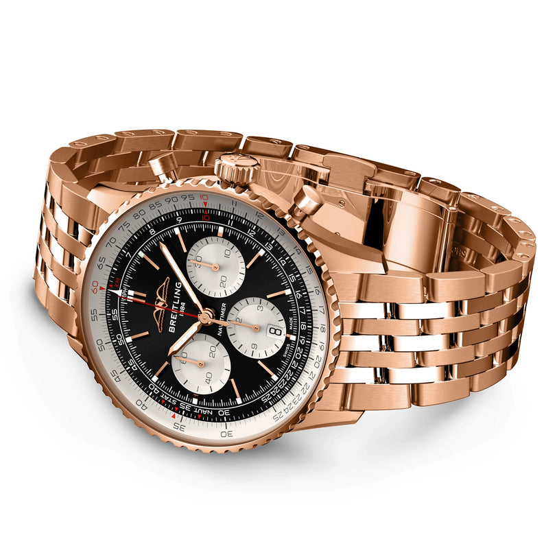 The Breitling Navitimer B01 Chronograph 43 in rose gold features a black dial, three subdials, white outer ring, five-link bracelet, and the acclaimed Breitling 01 calibre, displayed at an angle.