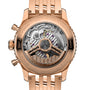 Close-up of the Breitling Navitimer B01 Chronograph 43’s rose gold case, showcasing its detailed Breitling 01 calibre movement through a transparent case back.