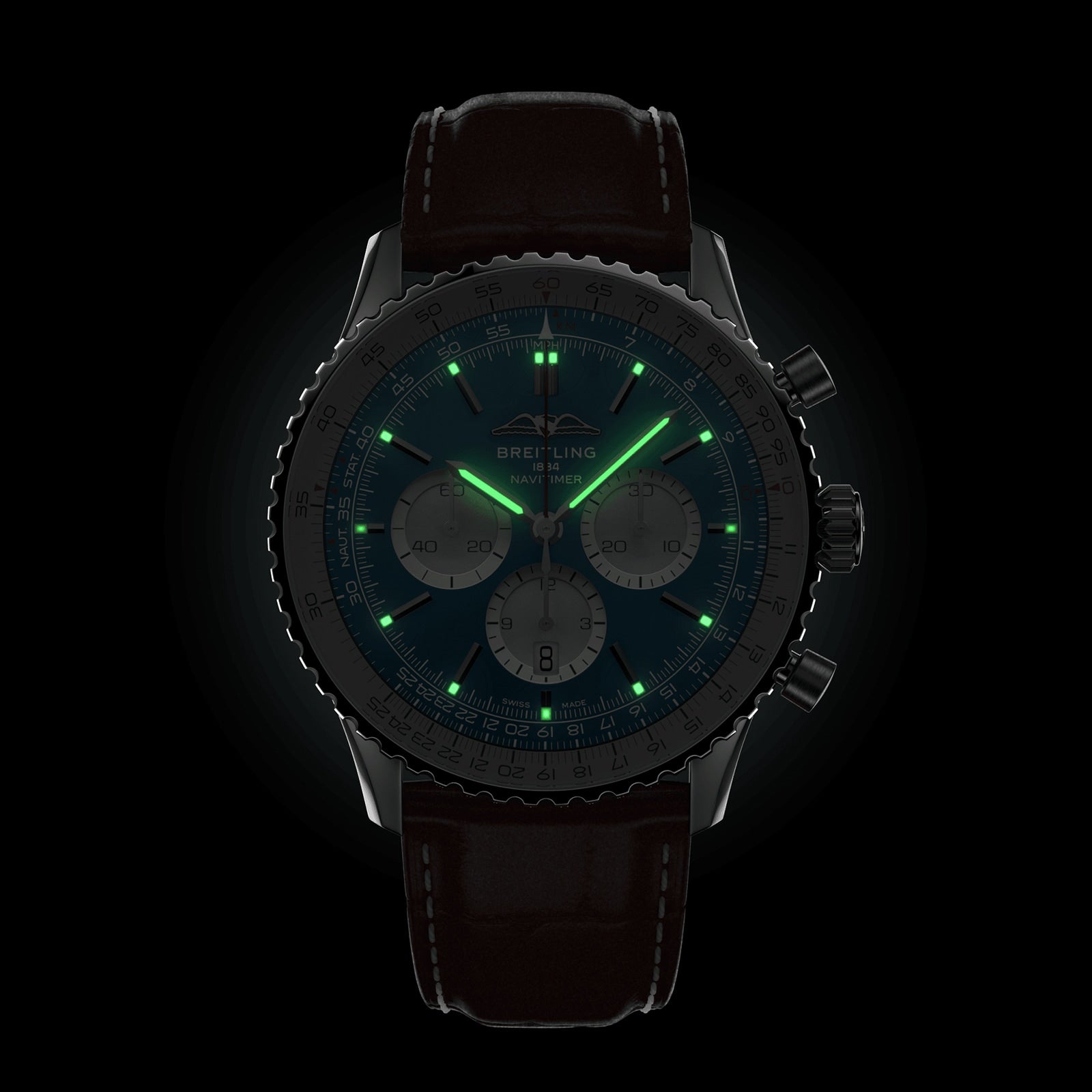 The Breitling Navitimer B01 Chronograph 46 features a black strap and illuminated green hands and markers, set against a black background—an iconic pilot’s watch crafted for precision and style.