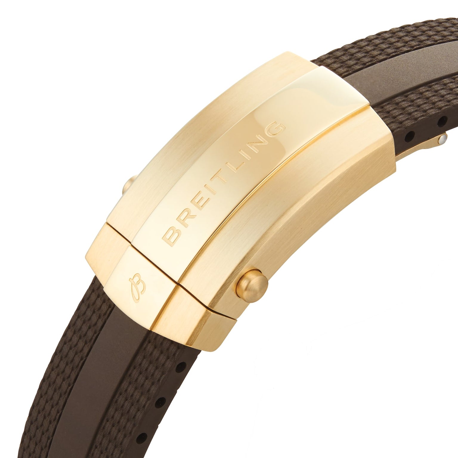 Close-up of a gold Breitling clasp engraved with the brand name, attached to a textured dark brown strap—an elegant detail from the water-resistant Superocean Automatic 44 collection.