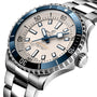 Close-up of the Breitling Superocean Automatic 42 dive watch with a stainless steel case, blue and white bezel, white dial, metal bracelet, and automatic movement.