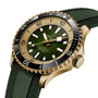 The Breitling Superocean Automatic 42 features a gold case, green dial, black bezel, luminescent hands, and a green textured rubber strap, shown at an angle against a white background.