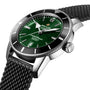Close-up of the Breitling Superocean Heritage B20 Automatic 46, featuring a green dial, black bezel, date display, textured black strap, and COSC-certified Breitling B20 movement.