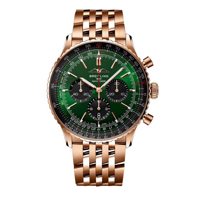 The Breitling Navitimer B01 Chronograph 46 features a gold case, green and black dial with three subdials, a gold metal link bracelet, and the renowned Breitling 01 movement—an iconic timepiece.