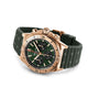 The Breitling Chronomat B01 42 features a red gold case, green dial with three subdials, textured green rubber strap, and is powered by the Breitling 01 calibre.