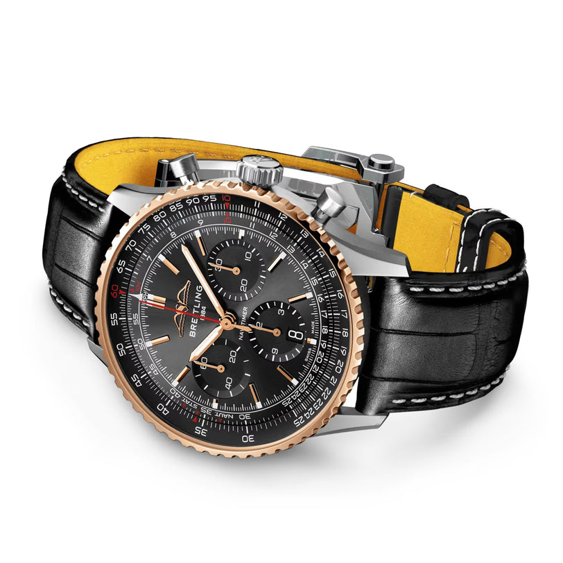 The Breitling Navitimer B01 Chronograph 43mm Limited Edition is a luxury aviation watch featuring a black and gold bezel, black dial with multiple subdials, and a black leather strap with yellow inner lining.