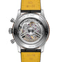 The back of the Breitling Navitimer B01 Chronograph 43mm Limited Edition reveals intricate mechanical gears through a transparent case, while a yellow leather strap and engraved edge details evoke classic pilot's chronograph style.