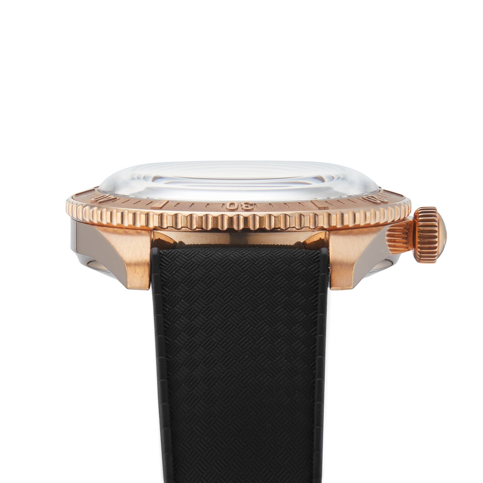 Side view of the Oris Divers Sixty-Five Date, a retro diver’s watch with a bronze case, ridged bezel, domed glass, and black textured strap.